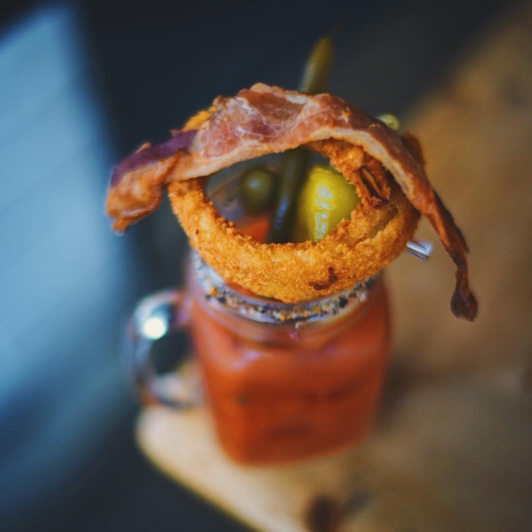 Bloody mary with bacon garnish