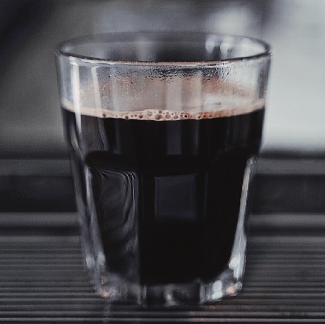 Dark iced coffee in a tall glass